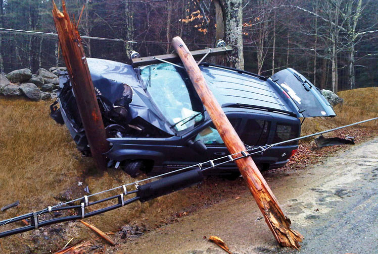 Car accident with pole and power lines on ground